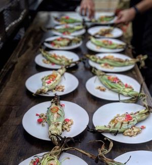 bread service 'in the husk' filled with scratch-made sweet corn butter - available seasonally on catering menus at The Easy Vegan - Food Truck in Denver