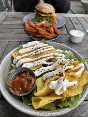 A very delicious vegan salad and a vegan burger with a share sweet potato fries with vegan mayo on the side. Love this 🥰  at Halifax Burgers in Koege