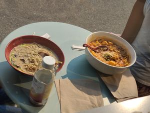 Neighbor ordered Black Garlic Ramen and Laksa w Extra Tofu Puff.  at Nan's Noodle House in Calgary