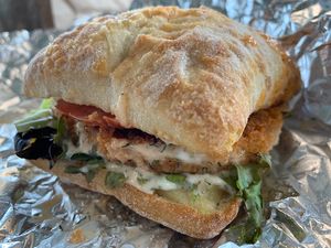 Buffalo Chick-n Sandwich on Artisan bun  at Veg-n in Okemos