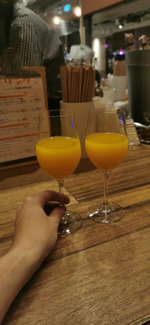 Mango Mimosas at Champagne & Gyoza Bar in Osaka