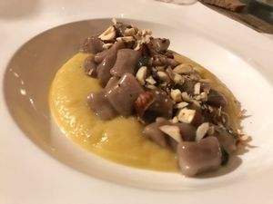 chestnut gnocchi with toasted hazelnuts served on a apple creme at Fattoria San Martino in Montepulciano