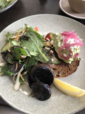 Smashed avocado on Kapiti grain toast with side of mushrooms  at Otaki Kitchen in Otaki