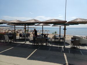 Tables near the beach at Pizza Amici in Thasos
