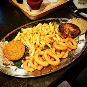 Sharing burger and chips platter at Mod's Vegan Cafe at the Thirsty Scholar in Manchester