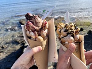 left: Ferrero rocher ice cream, brownie pieces, chocolate chips, cream, cherry sauce / right:  Pistachio ice cream, hazelnut pieces, crunchy wafer, cream, nutella  at Mordisquitos Cafe in Tenerife