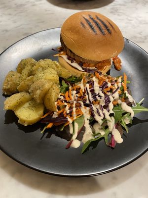 Kimchi burger with green and potato salad  at Kafé Plattan in Stockholm