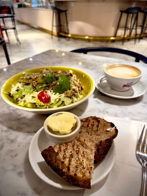 Caesar salad with smoked tofu, the bread was warm and tasted really good! at Kafé Plattan in Stockholm