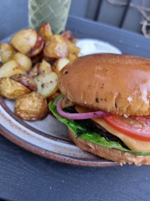 Takeaway burger and a huge pile of potatoes at Plant Food in Aarhus