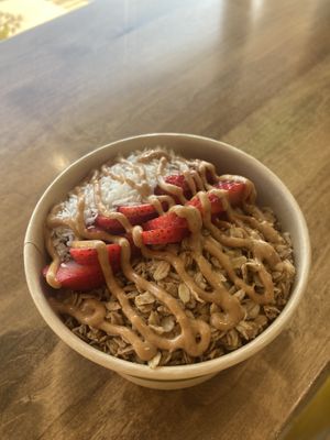 Açaí bowl with strawberries, peanut butter drizzle, and coconut flakes 😋 super tasty and the environment here was very kind & welcoming!  at Asava Juice & Smoothies in Kanab