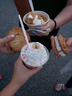 Cookie sandwiches, a pride themed unicorn and vanilla soft serve with caramel and graham crackers at Like No Udder in Providence