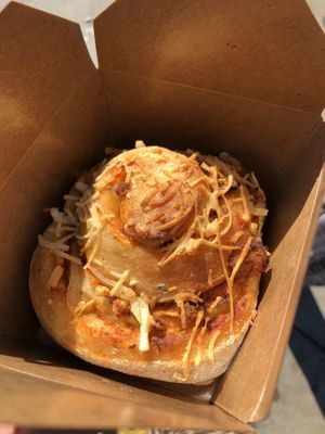 Vegan sausage and cheese pizza. Pretty much a savory filled cinnamon roll  at Baked Vegan Sweets in Long Beach