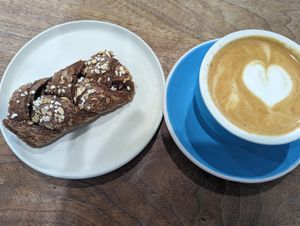Chocolate oat twist (with some sort of Nutella filling) and oatmilk cappuccino at 1 Oz Coffee in Mountain View