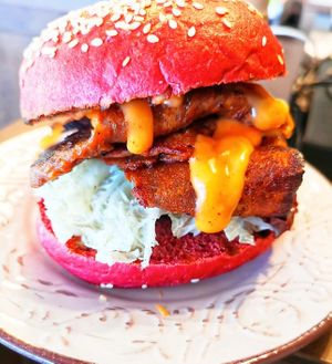 The Dirty Burger with vegan "bacon' and beetroot bun. at The Forest in Oroklini