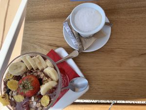 latte and açaí bowl at Terpsi N Oia in Santorini