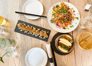 Mila Roll, bao buns, and mango satay slaw, as well as the virgin mojito and the cider on tap   at MILA in Vancouver