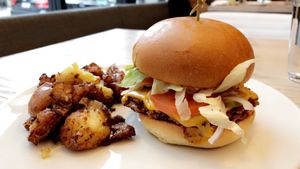 Burger, potatoes  at MILA in Vancouver