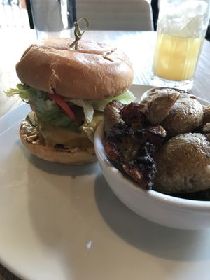 Smash Burger w/smashed potatoes   at MILA in Vancouver