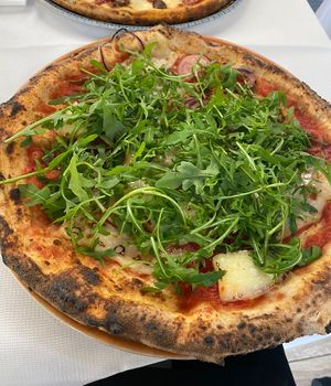Toppings hidden underneath a mountain of arugula…🤣  at Ciro and Sons in Florence