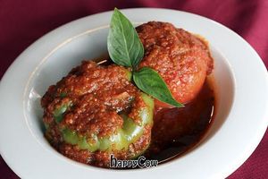 Vegan Stuffed Pepper and Tomato stuffed with rice, textured vegetable protein, yellow split peas topped with a spicy yet sweet fresh tomato sauce.  at Cafe Natasha's Kabob International in St Louis