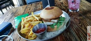 Asian Burger: Tamari-marinated grilled tofu, peanut satay sauce, homemade kimchi, mayonnaise, and arugula. at Vrutal - Poblenou in Barcelona