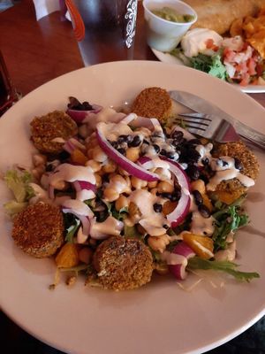 Falafel salad. That's tahini on top. at Gun Flint Tavern in Grand Marais