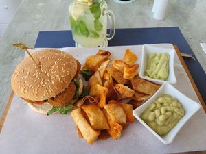 Falafel and hummus burger with nachos and dips (vegan) at Hippocampus in Protaras