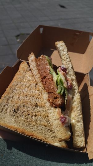 Vegan croque with burger and red beet bacon at Cropains in Bruges