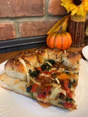 Vegan slice: vegan cheese, spinach, tomato, beyond meat sausage and a garlic knot crust.  at Pat D's Pizza in Howell