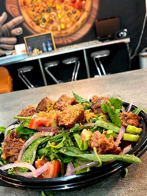 The Beyond meat patty salad topped with crispy fried onions at Bites7060 in Larnaca
