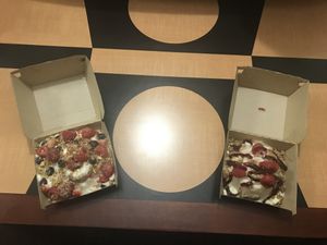 The left is my creation of a cream cheese cinnamon roll with blueberries, strawberries, raspberries and pecans. The right is their lemon tart roll. Equally delicious!!!!!  at Cinnaholic in Birmingham