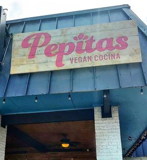 Store signage at Pepitas Vegan Taqueria in Denton