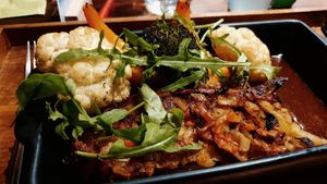 Potato tart, vegetable bouquet and dark vegetable sauce at Hummelbude in Essen