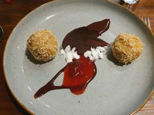 Plum dumplings with chocolate sauce at Hummelbude in Essen