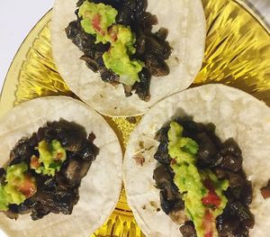 stewed mushroom tacos and guacamole. at Coco Bar  in Madrid