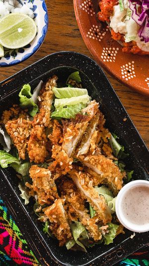 Caesar salad with KFC and insanely delicious dressing! at Plantivoros in Playa Del Carmen