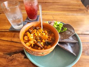 Mushroom pozole with berry lemonade  at Plantivoros in Playa Del Carmen