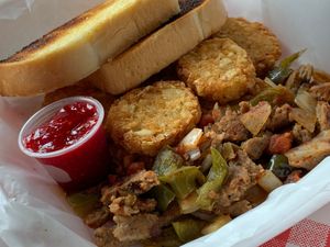 Vegan Italian Sausage Scramble: Potatoes, Green Peppers, Onions, Salsa with Potato Cakes (upcharge) and Sourdough Bread at Studio Grill in Kalamazoo