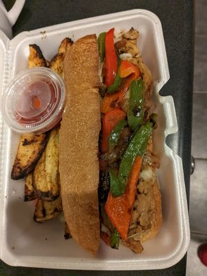 Philly Cheesesteak with potato wedges.  The steak is soy curls at Taste & See in Milledgeville