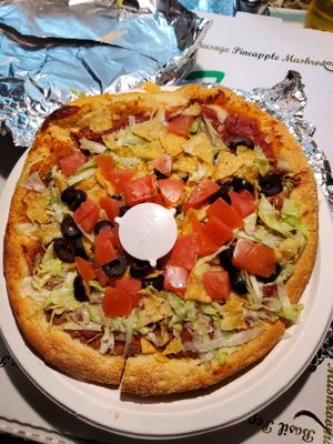 Taco pizza no meat or cheese. I asked and the refried beans are vegan. No lard.  at Tie Dye PIE Pizzaria in Lincoln City