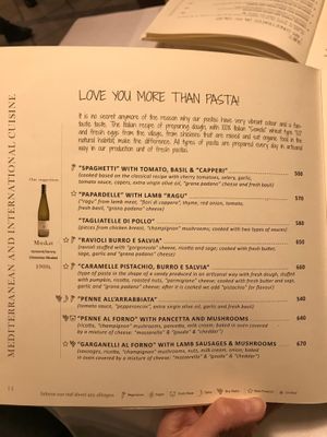 Another menu page, with vegan and vegetarian options marked at the bottom at Era in Tirana