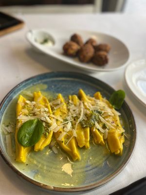The pumpkin rolls (fritters) and pistachio homemade pasta. at Era in Tirana
