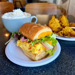 Ghostlight Coffee making my day better as usual 🥰🫶🏼 Vegan Frittata brunch sandwich, pumpkin choc chip muffin and an oatmilk latte with vegan whip.   at Ghostlight Coffee - Midtown in Dayton
