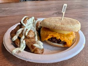  Vegan breakfast sandwich and a side of smash brown potatoes   at Ghostlight Coffee - Midtown in Dayton