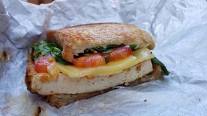 Vegan breakfast sandwich w/lemon pepper tofu ($7). Delicious and cheap. at Misfit Coffee in Minneapolis