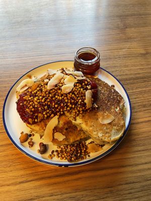 Poppy seeds and lemon pancakes with berry chia seed jam and maple syrup  at Kolm Tilli in Tartu