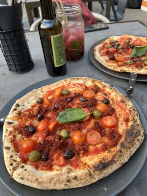 Nduja pizza and blackcurrant Cuba mojito   at Kolm Tilli in Tartu