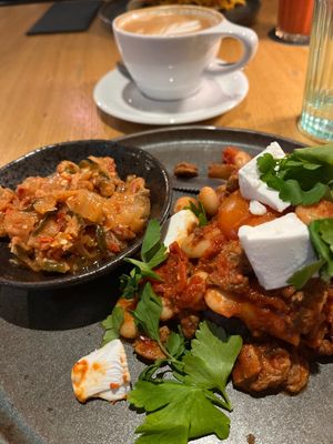 Vegan shakshuka with cilantro, champignons, feta and focaccia, + extra kimchi. at Kolm Tilli in Tartu