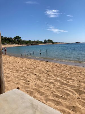 Low key beach - view from restaurant  at Spiaggia Vatsa in Kefalonia