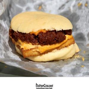 vegan breakfast sandwich: sausage, tofu, and cheese on a fluffy muffin at A Taste of Life in Inglewood